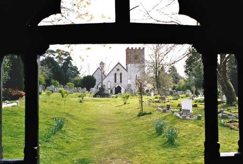 View through the lych gate at All Saints Church, Catherington, Hampshire