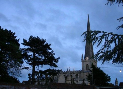 St James' Parish Church at night with Cedar and Pine