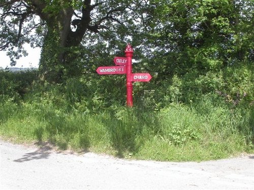 An unusual red sign post. Somerset, England