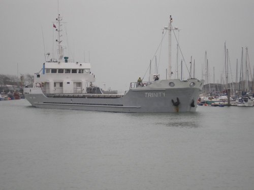 The Trinity passing through the open footbridge on the river Arun at Littlehampton.