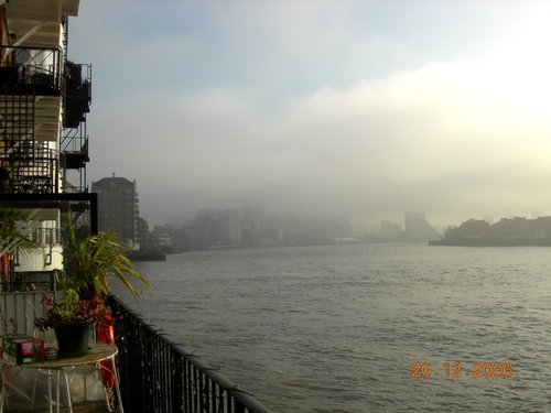 Foggy view of Canary Wharf from a warehouse conversion in Limehouse E14