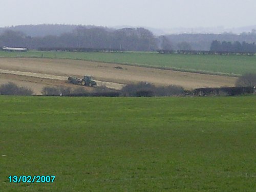 Looking out of Worksop towards the North. Tractors busy in this rural area