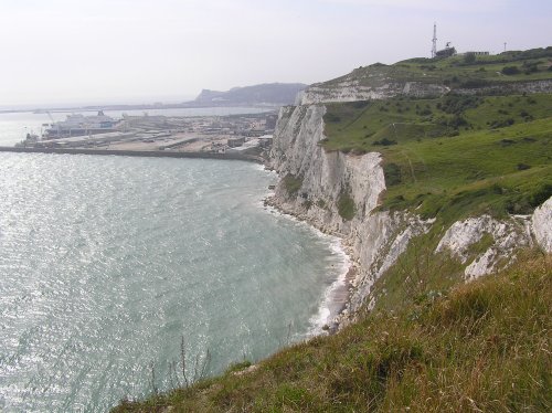 The white cliffs of Dover, Kent, Dover harbour, and on top of the hill, the coastguard station.