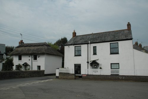 On the left of picture is Tudor cottage built in the 17th century, Stratton, Cornwall, England