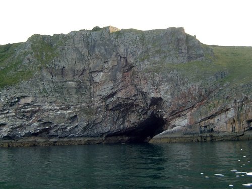 Berry Head seen from the sea showing the colours in the cliff.