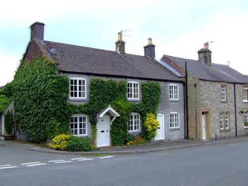 Lovely stone cottages in Ashford in the water