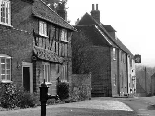 The Golden Lion Inn and old water tap, Southwick.