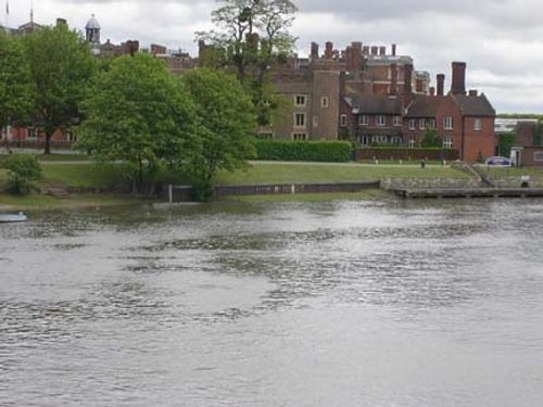 View of Hampton Court Palace while crossing the Thames