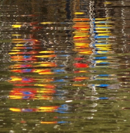 Reflection of party balloons in the Thames, Goring, Oxon.