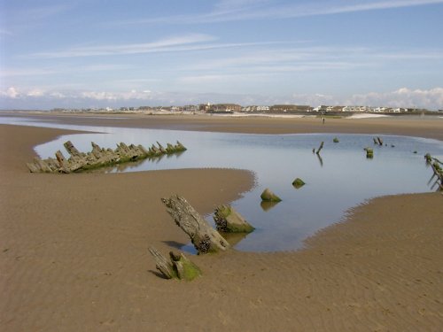 Timbers from the wreck of an old sailing ship on Cleveley's beach