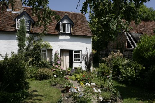 Cottage in village with  flowers