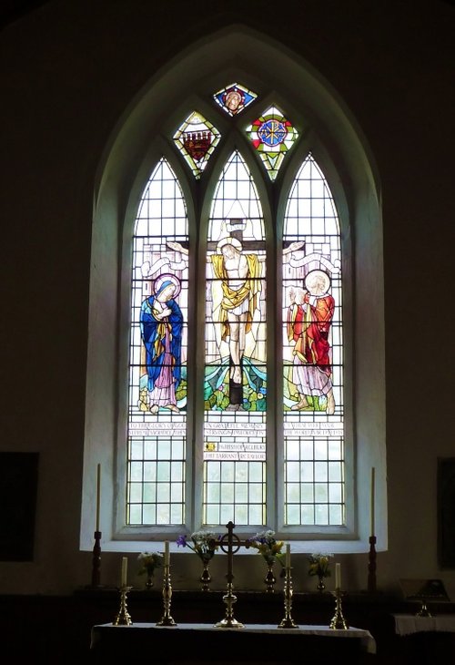 Stained Glass Window and Brass Candlesticks