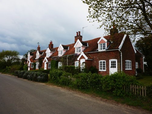 Cottages on the side of a very narrow country road