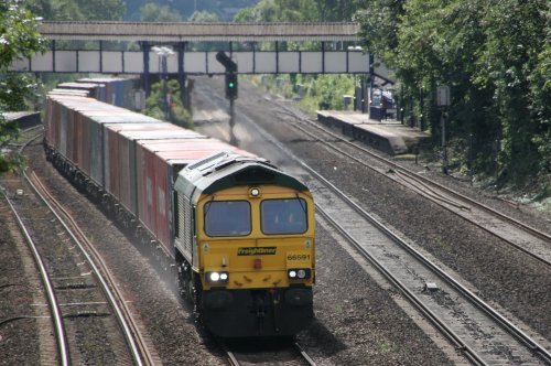 Freight train passing through Tilehurst Station