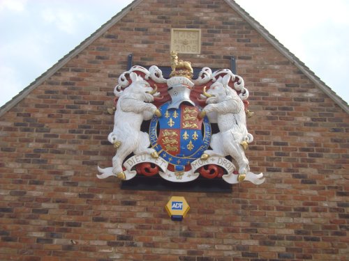 The Arms on the Tithe Barn building