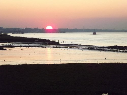 Sunset looking up the thames from the marshes