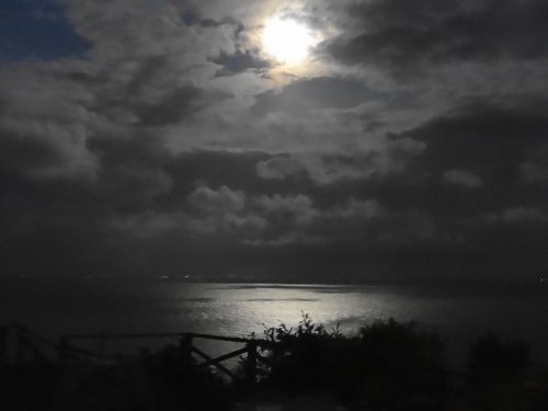 The moon is reflected in the English Channel at Folkestone