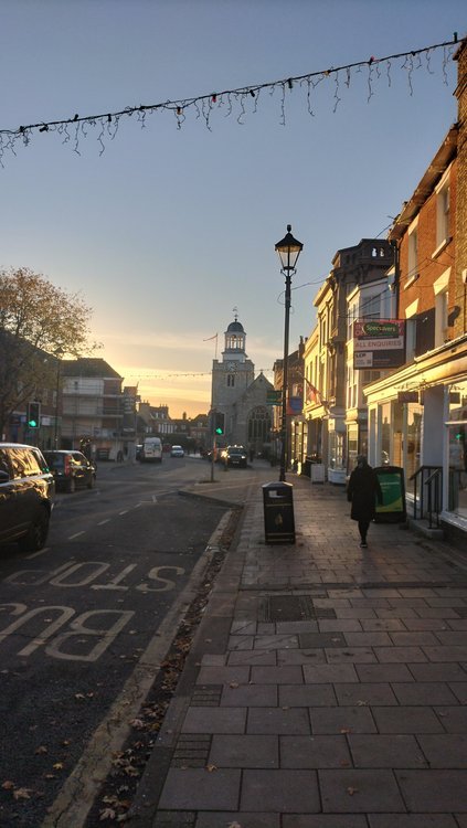 Looking along Lymington high street towards sunset