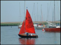 A young couple practice the art of sailing at Christchurch Wallpaper