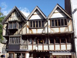 14th century coach house, this Tudor building is now a retail clothing store. Wallpaper