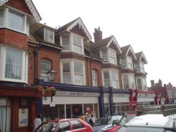 Cute little homes on top of shops in Seaford Wallpaper