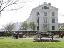 The imposing Victorian gable of No.1 The Crescent and The Evron Centre Gardens Wallpaper