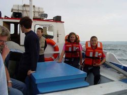 Local youngsters experience a trip on the preserved fishing coble 'Margaret'. Wallpaper