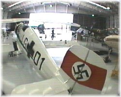 Planes in the hangar being worked on.  Duxford Air Museum, Camabridgeshire. Wallpaper