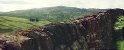 Stone walls lining the country road leading over the mountain pass to Ambleside. Wallpaper