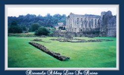 Though she lies in ruins Rievaulx Abbey still retains her grandeur Wallpaper