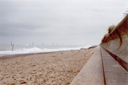 Sea Palling, Norfolk, at high tide including East coast anti tank defences from WW2 Wallpaper