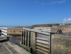 The canal sea lock overlooking summerleaze beach Wallpaper