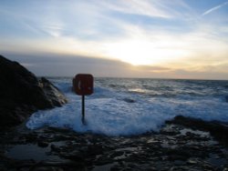 The sea rushing over Bude Breakwater, Cornwall Wallpaper