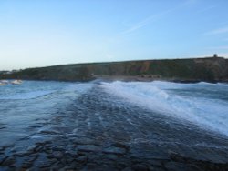 Waves rushing over the Breakwater Wallpaper