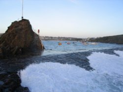 Waves in symmetry, rushing over the Breakwater at Bude, Cornwall Wallpaper