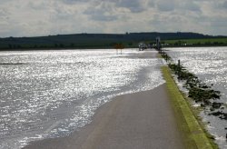 The tide crossing the causeway to Lindisfarne Wallpaper