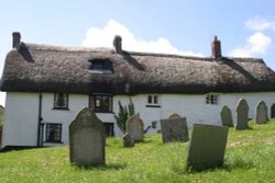 Traditional Devon cottages backing onto churchyard in Zeal Monachorum, Devon