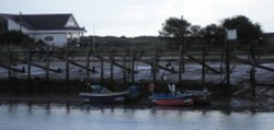 Fishing boats on the river Arun at Littlehampton 01/10/05 Wallpaper