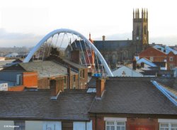 Trinity Church in Bolton, Lancashire. The arch is the new rail bridge over Newport St. Wallpaper