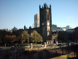 Manchester Cathedral seen from Salford side of the River Irwell Wallpaper