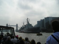 On the Thames in London. HMS Belfast with Tower Bridge in the background. Wallpaper