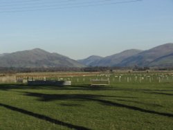 across the fields towards the mountains 
 Tywyn Gwynedd Wallpaper