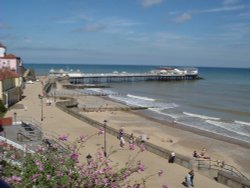The beach front at Cromer, with Cromer pier in the background, Norfolk