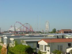 A view of Fantasy Island overlooking Caravan roof tops in the morning sun at 8:47AM, Ingoldmells Wallpaper