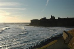 Tynemouth Castle and Priory, and North Pier with South Pier behind. Wallpaper