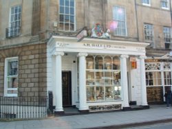 Apothecary shop Est. 1826, royal warrant sits atop portico.  Bath, AVON Wallpaper