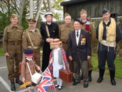 Mainwaring\'s Mob proudly pose with one of the veterans at Eden Camp, Malton, North Yorkshire. Wallpaper