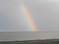 Rainbow at sea. Mablethorpe beach in Oct 05 Wallpaper