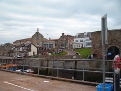 Seahouses, Northumberland. A view of the town from the docks Wallpaper