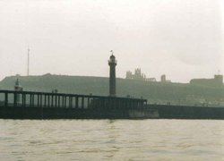 A view of Whitby Abbey taken from a boat entering the harbour Wallpaper